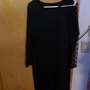 Women’s black dress, sheer right sleeve, solid left sleeve
